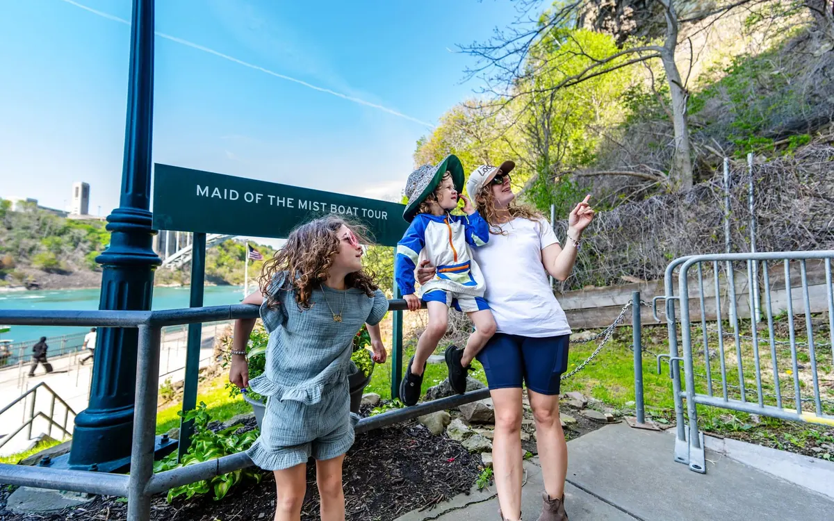 Visitors lined along the railing above the gorge on the Canadian bank at Niagara
