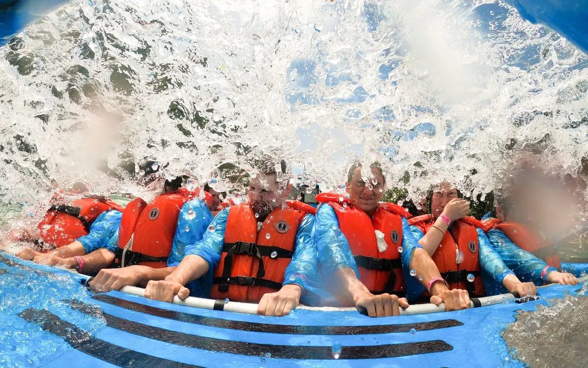 A jet boat throwing spray as it works the rapids of the Niagara River below the gorge
