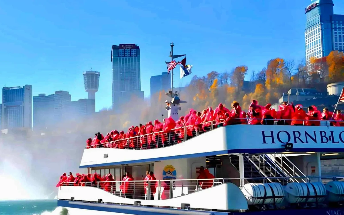 A tour boat pushing into the spray at the base of the Horseshoe Falls at Niagara