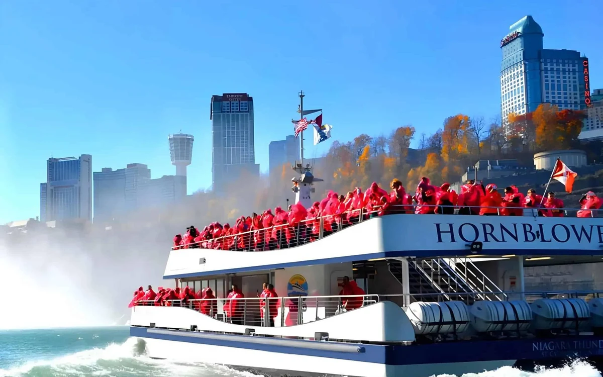 A tour boat below the falls, surrounded by spray on the Canadian side