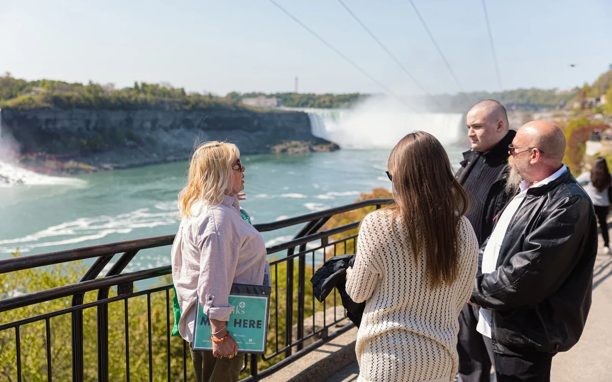 The viewing terrace above the lit falls with the gorge in shadow below